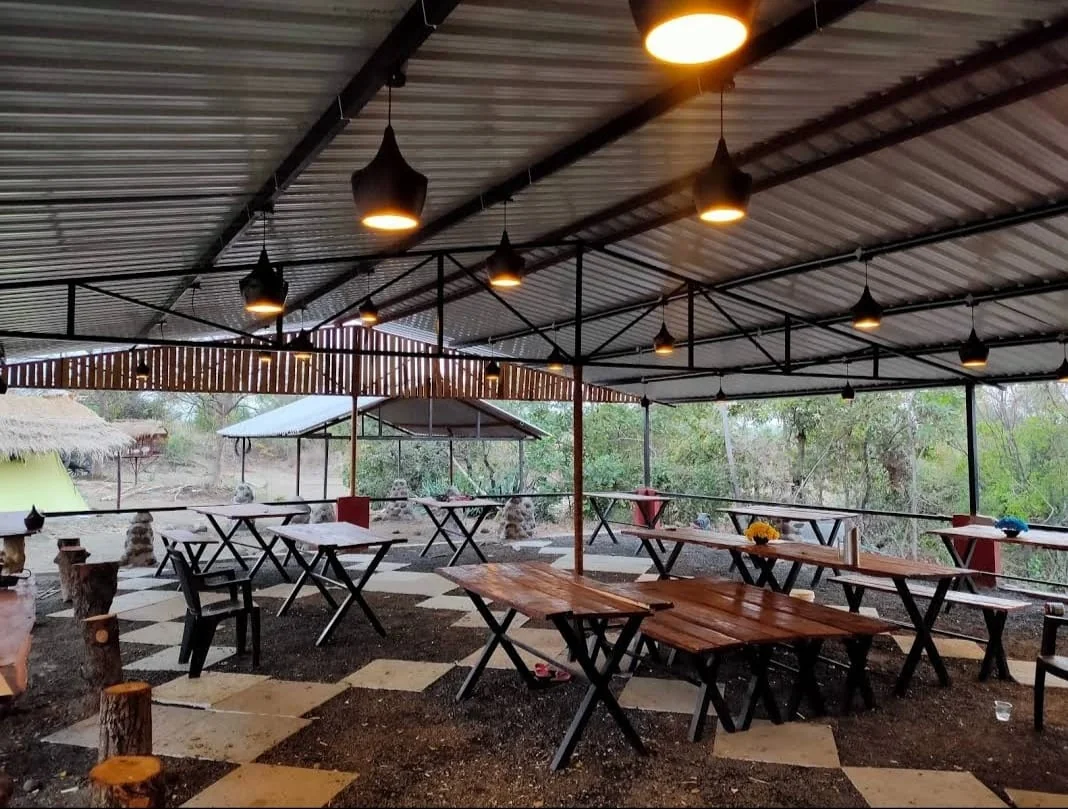 Open lantern-lit dining and gathering pavilion